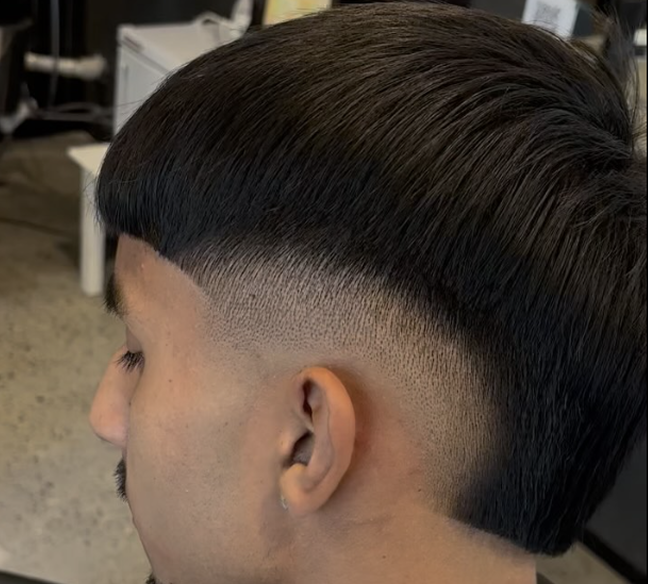 Bowl cut paired with a high skin fade.